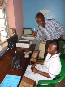 Dr Rogers carrying out computer training
