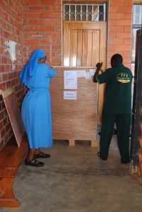 Unpacking the new processor with help from Sister Stella