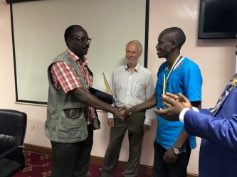 President of RC Kampala with Jim McWhirter and Rogers Kubuye
